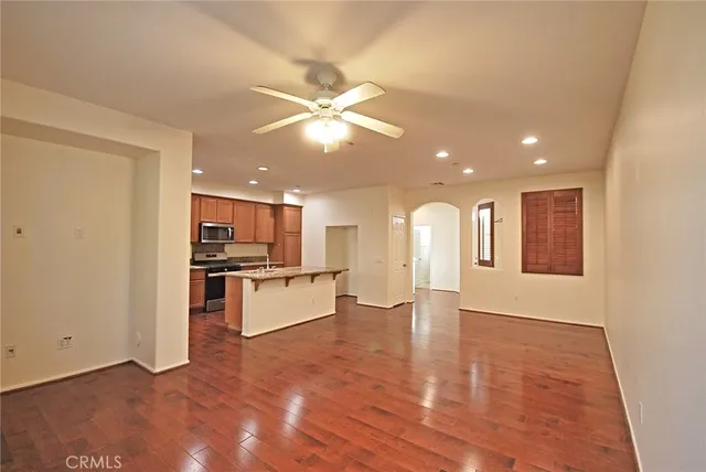 a view of kitchen with stainless steel appliances refrigerator oven and stove