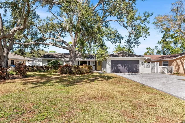 a view of a house with a snow in the yard