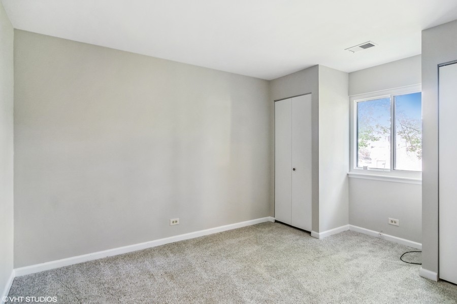 545 Greystone Lane, Unit A2 Wheeling, IL 60090 - Photo 12 of 21 a view of an empty room and window