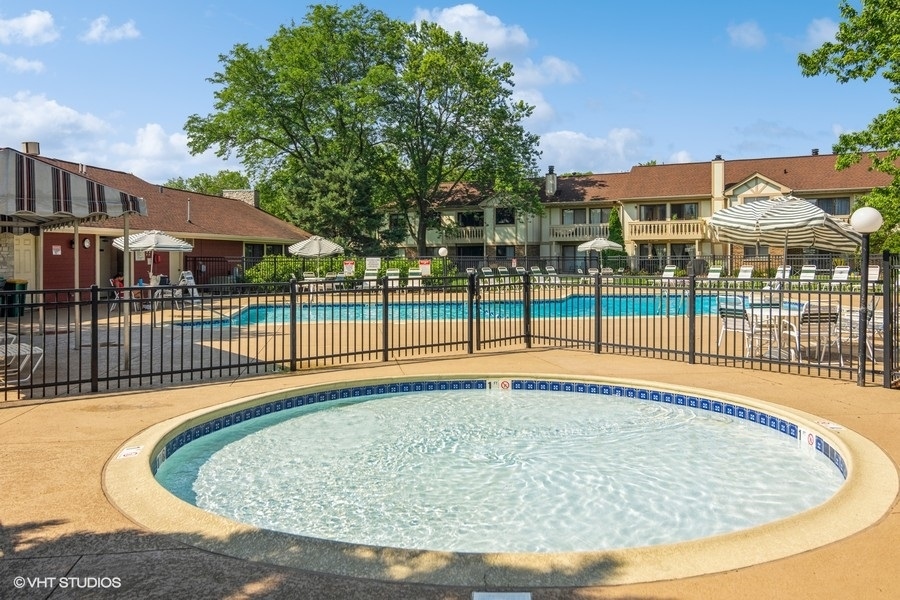 545 Greystone Lane, Unit A2 Wheeling, IL 60090 - Photo 16 of 21 a view of a house with a swimming pool