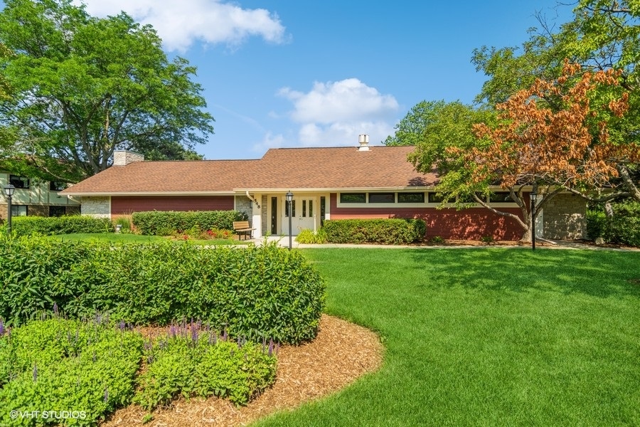 545 Greystone Lane, Unit A2 Wheeling, IL 60090 - Photo 20 of 21 a front view of house with yard and trees