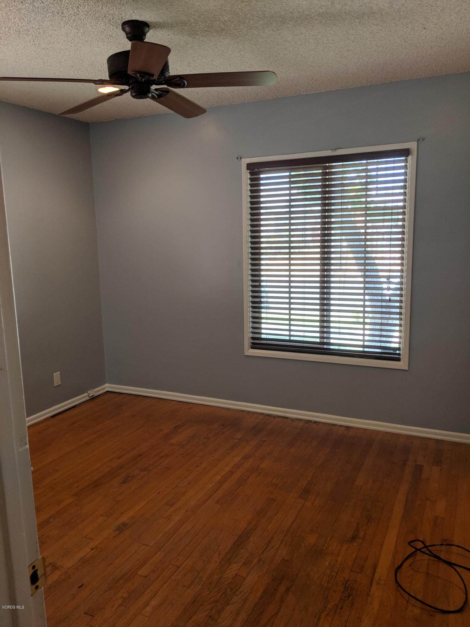 19518 Hart Street Reseda, CA 91335 - Photo 14 of 16 a view of an empty room with windows
