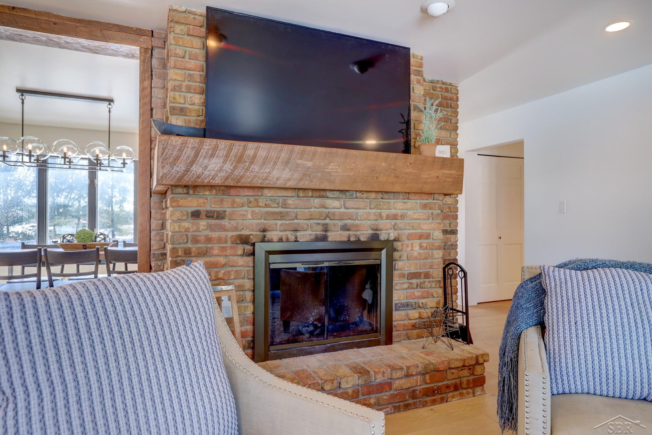 8111 East Burt Road Birch Run, MI 48415 - Photo 10 of 42 Natural brick fireplace in the great room