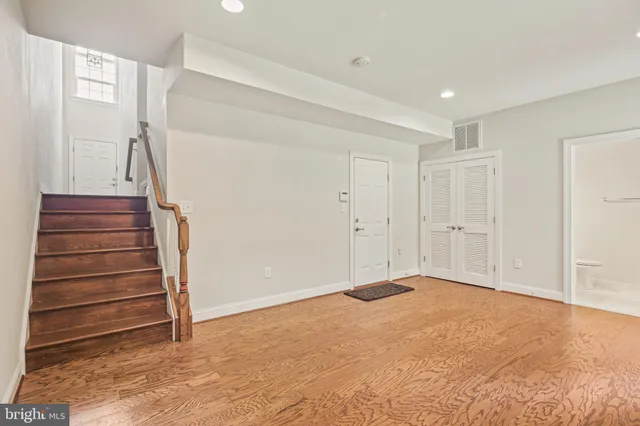 a view of an empty room with stairs