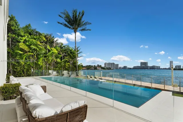 a view of a swimming pool with lounge chair