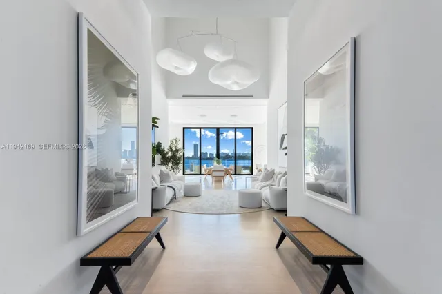 a very nice looking living room with a couch and a chandelier