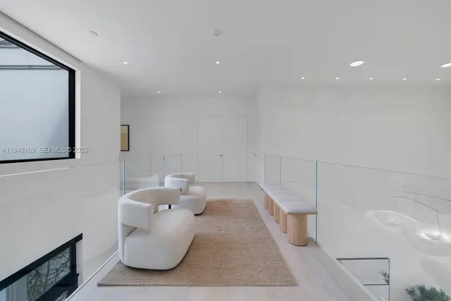 a bathroom with a bathtub sink and mirror