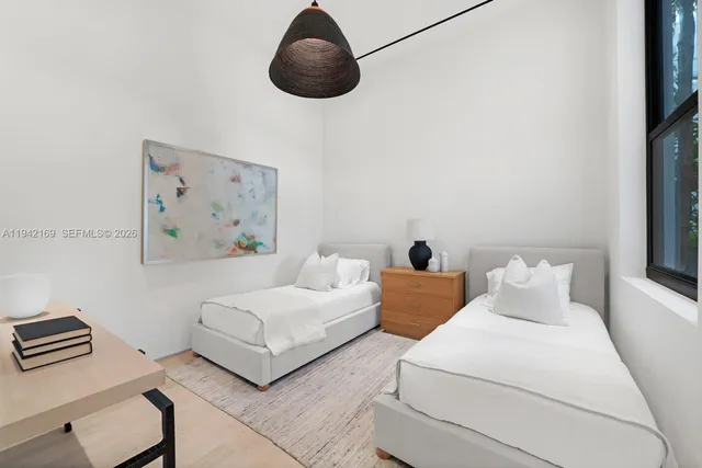 a bedroom with bed and a night stand