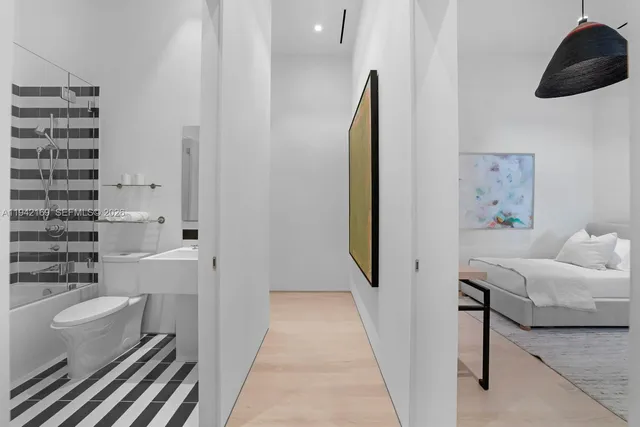 a bathroom with a bathtub and shower