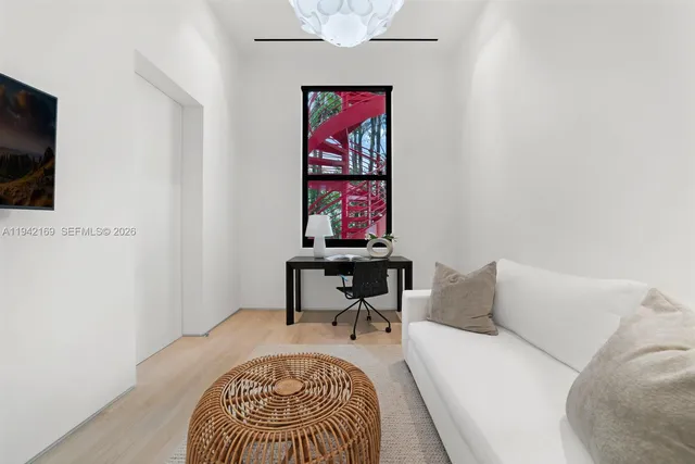 a bedroom with a bed and a chair