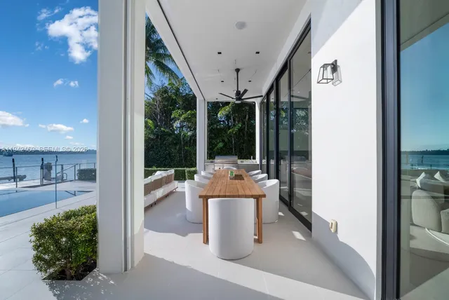 a view of a living room and a floor to ceiling window