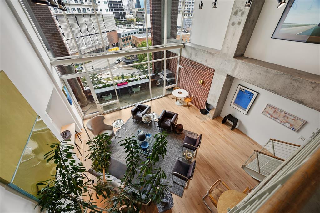 2011 Cedar Springs Road, Unit 305 Dallas, TX 75201 - Photo 17 of 27 Soaring ceilings and expansive windows frame the open-concept living space