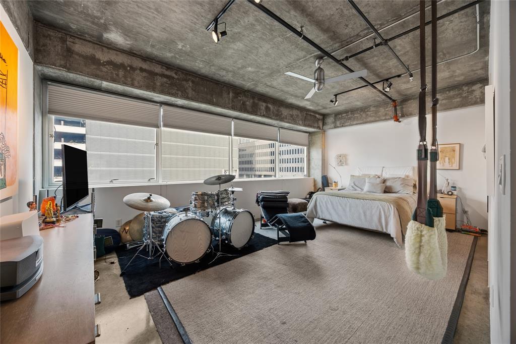 2011 Cedar Springs Road, Unit 305 Dallas, TX 75201 - Photo 18 of 27 Concrete ceilings featuring exposed conduit and track lighting