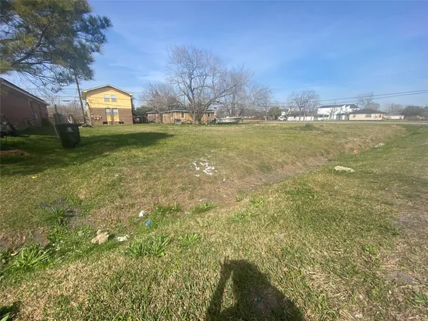a view of a lake with a big yard