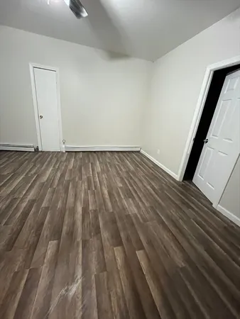a view of wooden floor in an empty room
