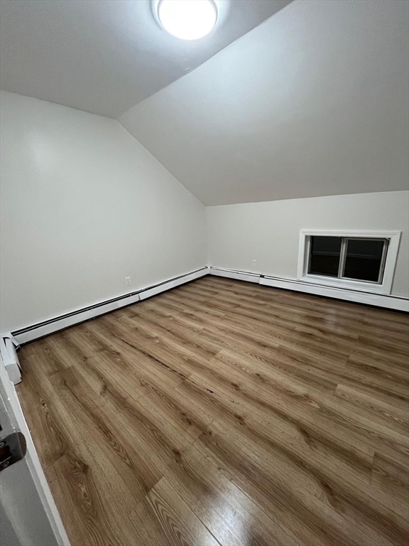 286 Griffin Street, Unit 2 Fall River, MA 02724 - Photo 6 of 9 a view of an empty room with wooden floor and a window