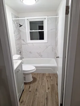 a bathroom with a toilet a sink and a bathtub
