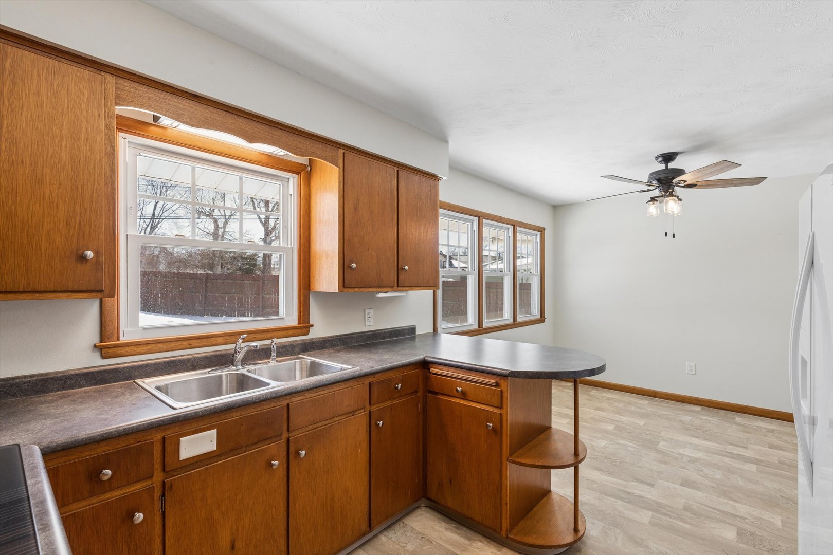 1245 8th Avenue North Clinton, IA 52732 - Photo 13 of 32 a kitchen with stainless steel appliances granite countertop cabinets and window