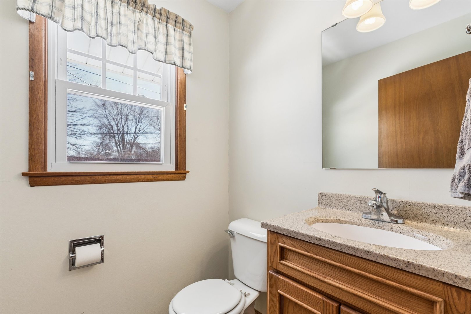 1245 8th Avenue North Clinton, IA 52732 - Photo 14 of 32 a bathroom with a granite countertop sink and a mirror