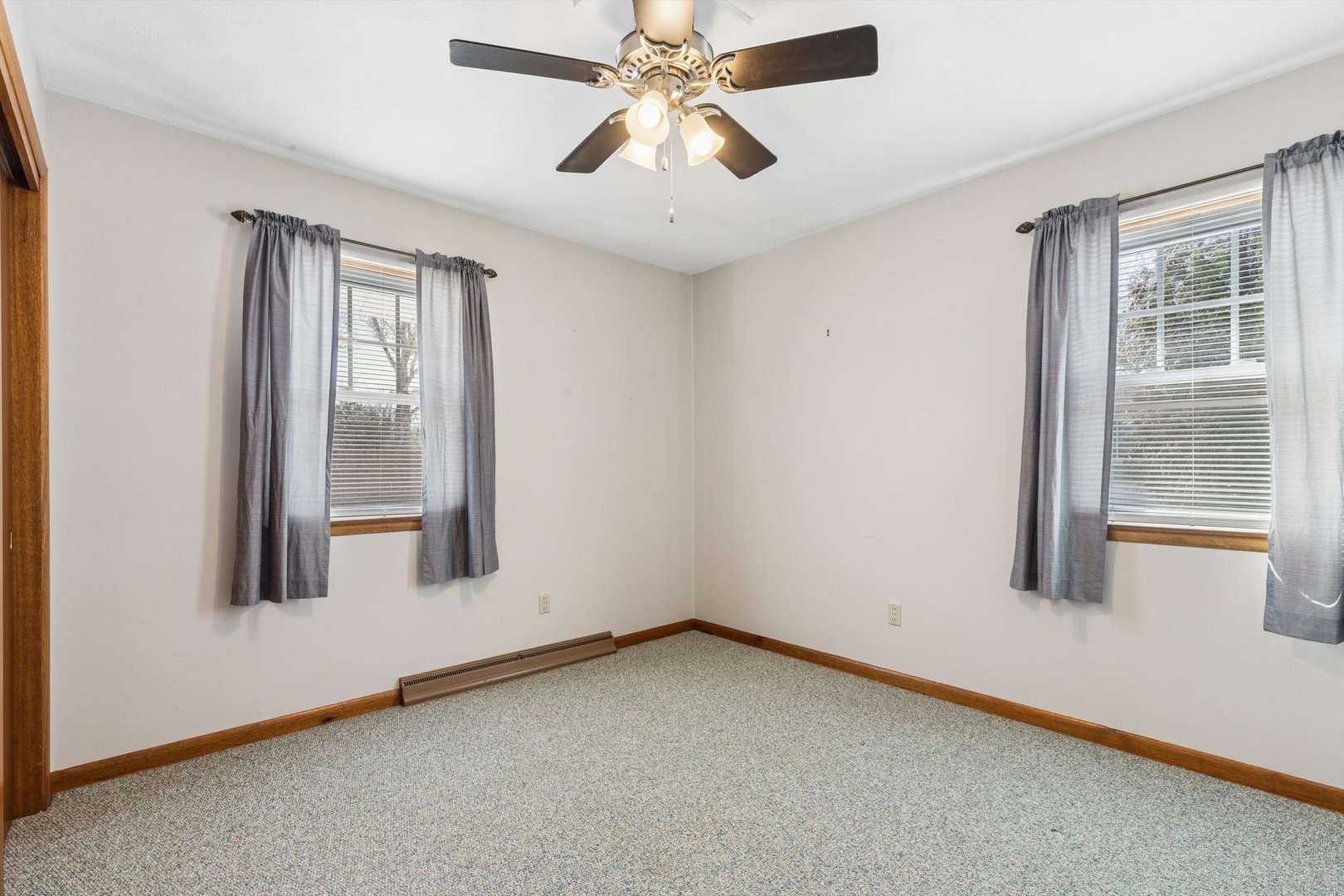 1245 8th Avenue North Clinton, IA 52732 - Photo 18 of 32 a view of room with window and ceiling fan