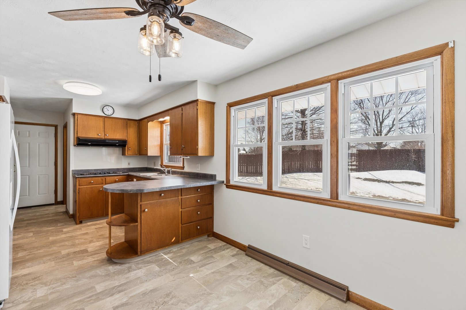 1245 8th Avenue North Clinton, IA 52732 - Photo 9 of 32 a kitchen with stainless steel appliances granite countertop a stove and a refrigerator