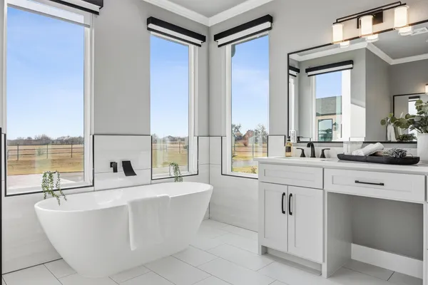 a living room with kitchen island a large window cabinets and a sink