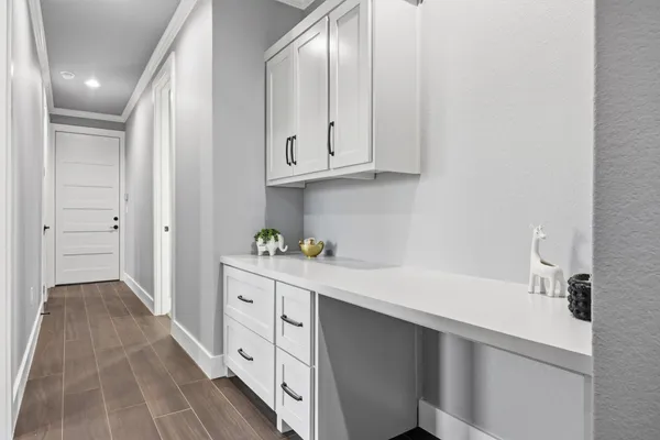 an empty room with a window and a ceiling fan