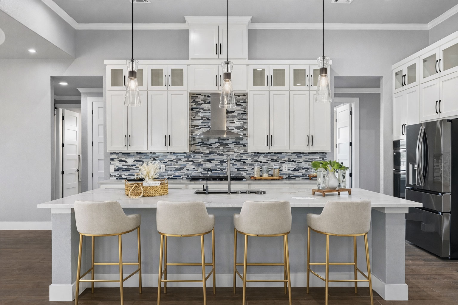 178 Balch Road Elgin, TX 78621 - Photo 7 of 40 Kitchen featuring glass insert cabinets, stainless steel fridge, Brazilian quartz counters, dark wood finished floors, and crown molding