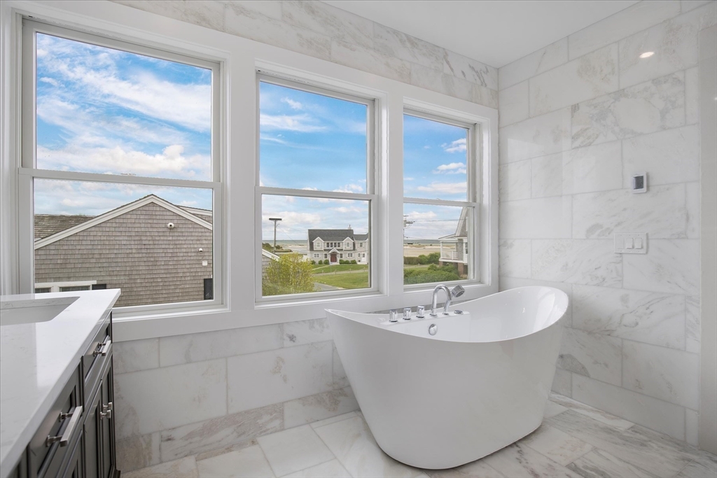 200 Sixth Avenue Barnstable, MA 02601 - Photo 29 of 39 a bathroom with a sink a bathtub and next to a window