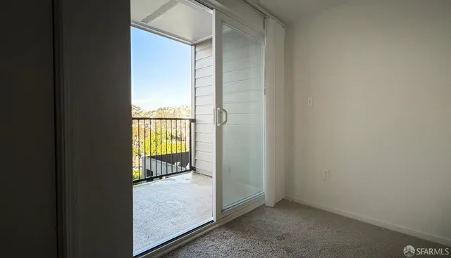 a view of an empty room and window