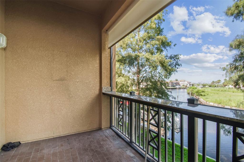 6533 Channelside Drive New Port Richey, FL 34652 - Photo 13 of 44 a view of balcony and trees