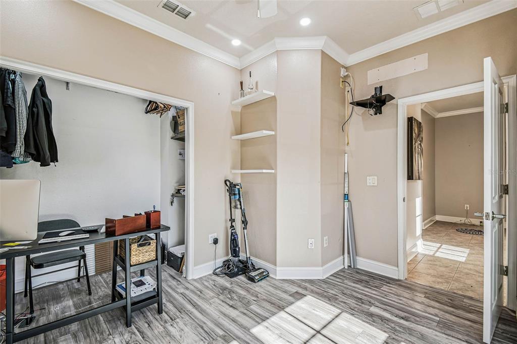 6533 Channelside Drive New Port Richey, FL 34652 - Photo 16 of 44 a view of walk in closet with clothes and shoes
