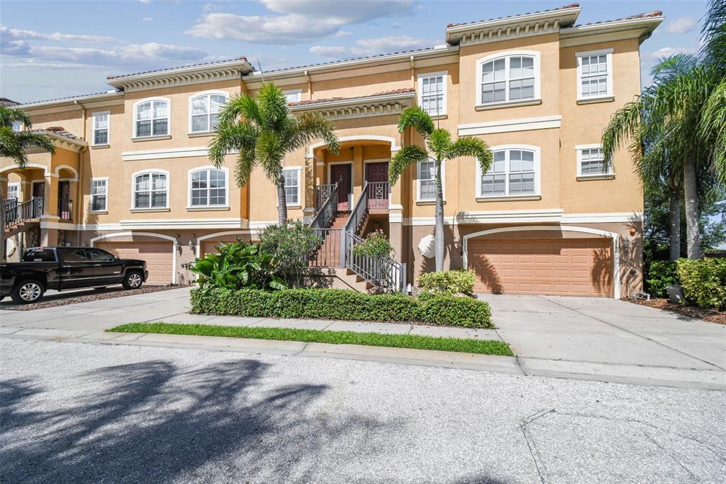 6533 Channelside Drive New Port Richey, FL 34652 - Photo 2 of 44 a front view of a house with garden