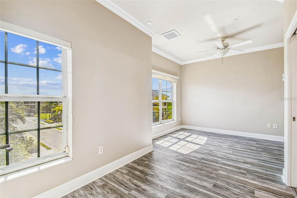 6533 Channelside Drive New Port Richey, FL 34652 - Photo 29 of 44 an empty room with windows and closet