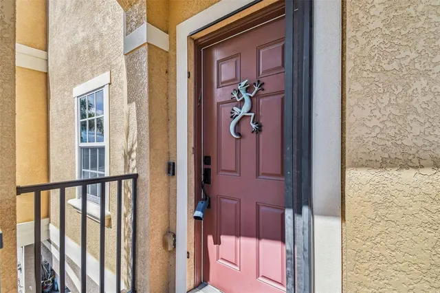 a view of a door and a window
