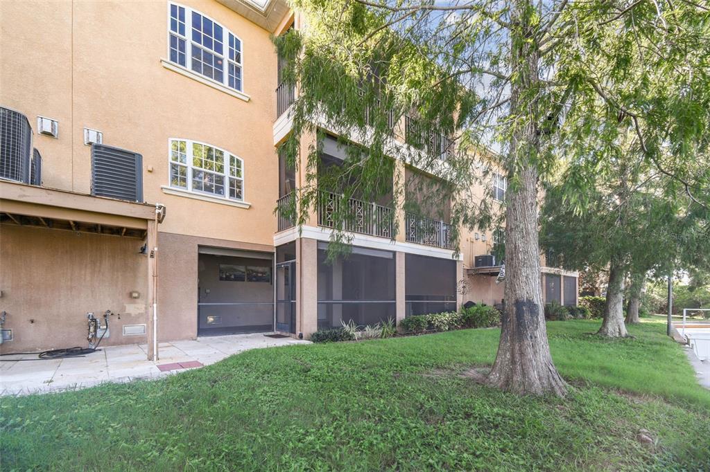 6533 Channelside Drive New Port Richey, FL 34652 - Photo 34 of 44 a view of a house with a yard and tree