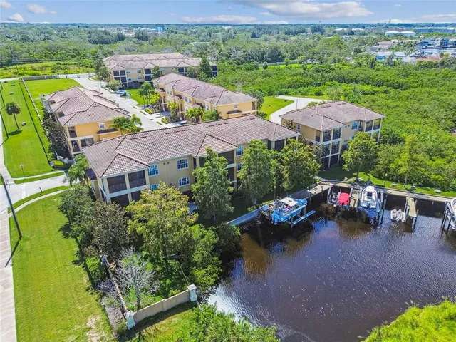an aerial view of a houses with garden