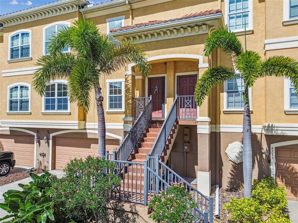 6533 Channelside Drive New Port Richey, FL 34652 - Photo 39 of 44 a front view of a house with a yard