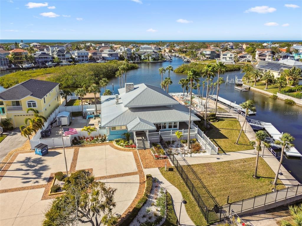 6533 Channelside Drive New Port Richey, FL 34652 - Photo 40 of 44 a view of a swimming pool with outdoor seating