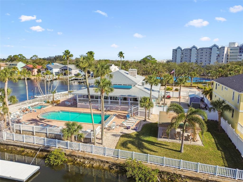 6533 Channelside Drive New Port Richey, FL 34652 - Photo 42 of 44 a view of a swimming pool with outdoor seating and a patio