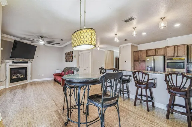 a view of a dining room with furniture and wooden floor