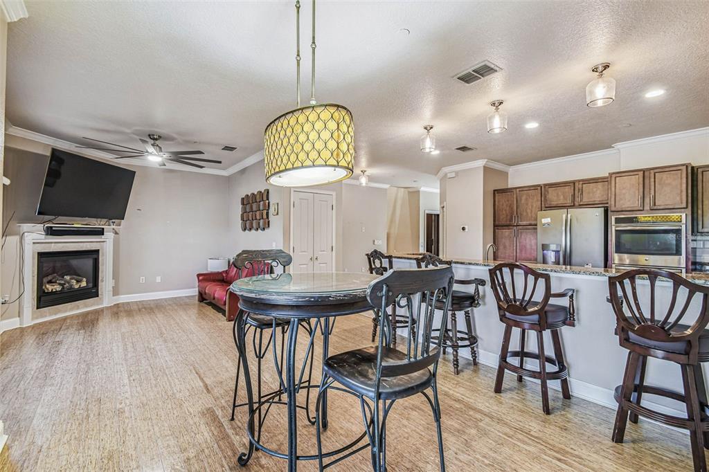 6533 Channelside Drive New Port Richey, FL 34652 - Photo 10 of 44 a view of a dining room with furniture and wooden floor