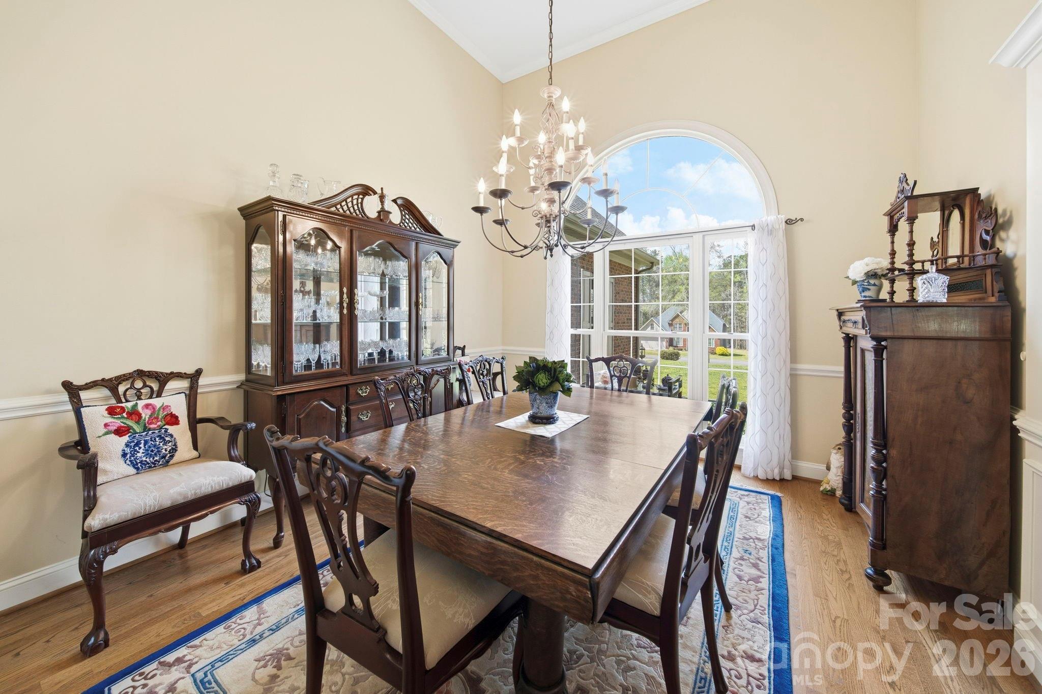 2909 Lakeshore Drive Chester, SC 29706 - Photo 12 of 44 a view of a dining room with furniture a chandelier and wooden floor