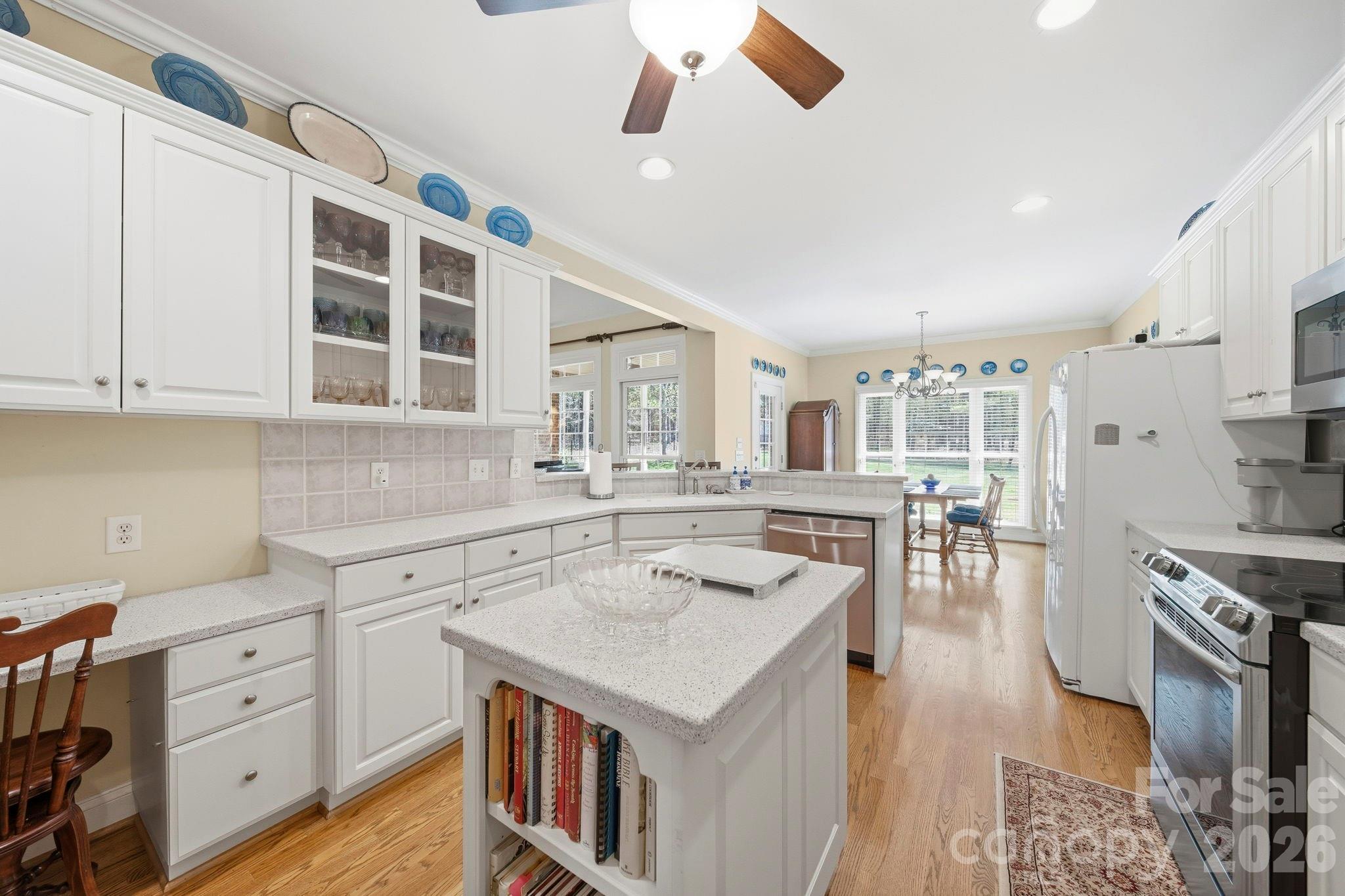 2909 Lakeshore Drive Chester, SC 29706 - Photo 22 of 44 a kitchen with a stove window and cabinets