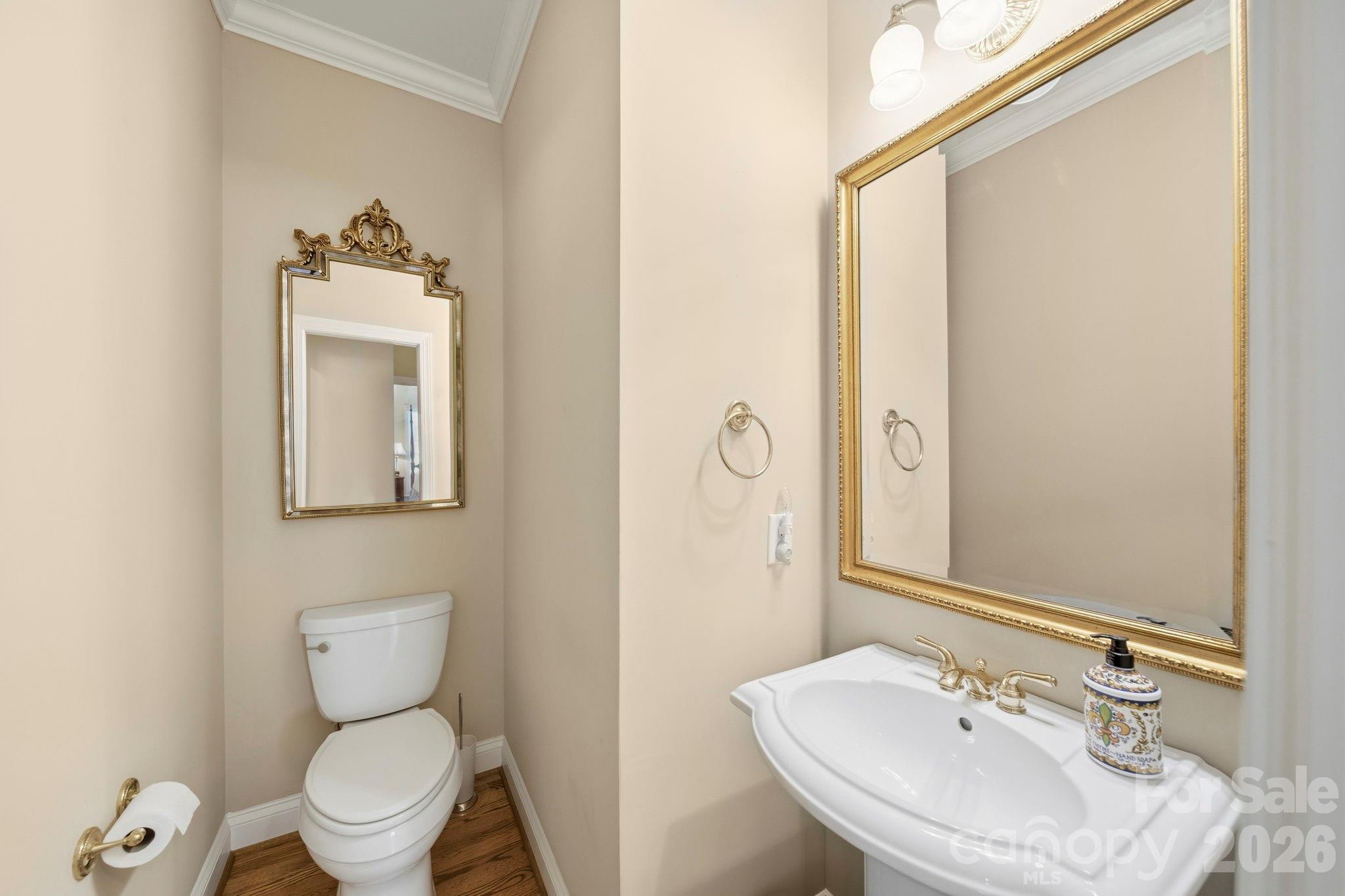 2909 Lakeshore Drive Chester, SC 29706 - Photo 28 of 44 a bathroom with a toilet sink and mirror