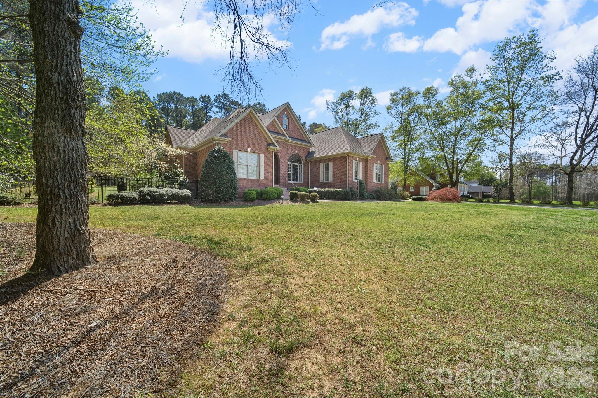 2909 Lakeshore Drive Chester, SC 29706 - Photo 3 of 44 a view of a big house with a big yard and large trees
