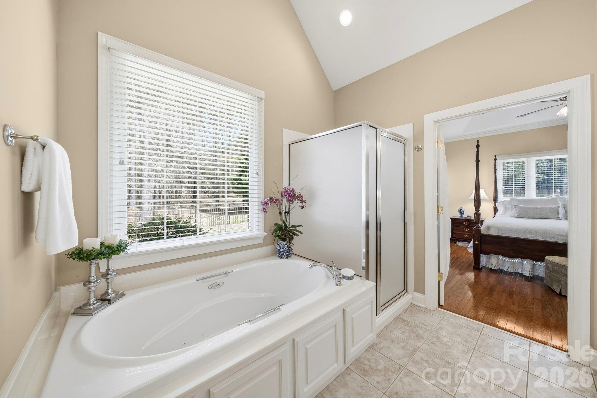 2909 Lakeshore Drive Chester, SC 29706 - Photo 34 of 44 a white bath tub sitting in a en suite bathroom next to a window