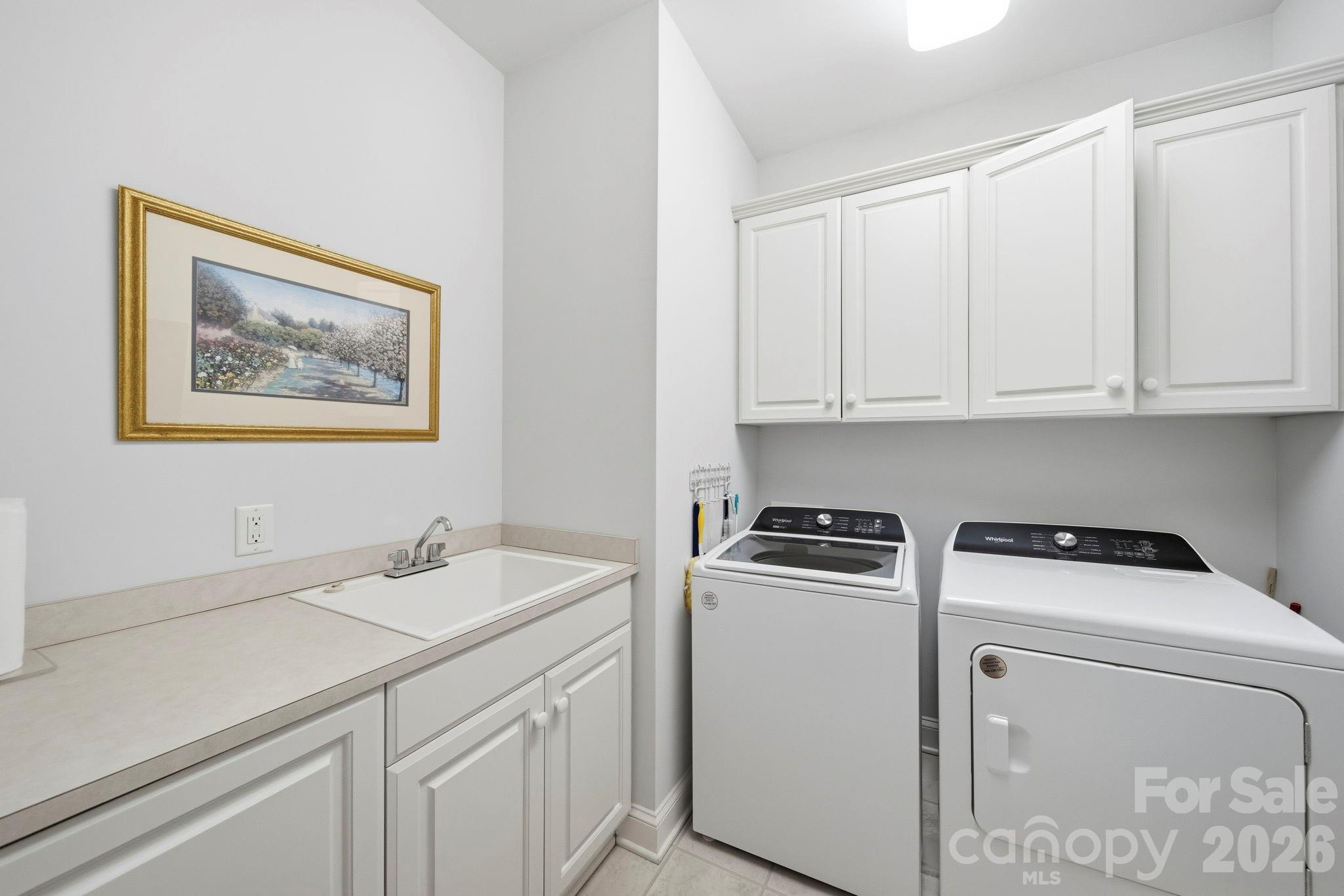 2909 Lakeshore Drive Chester, SC 29706 - Photo 43 of 44 a view of a storage and utility room with washer and dryer
