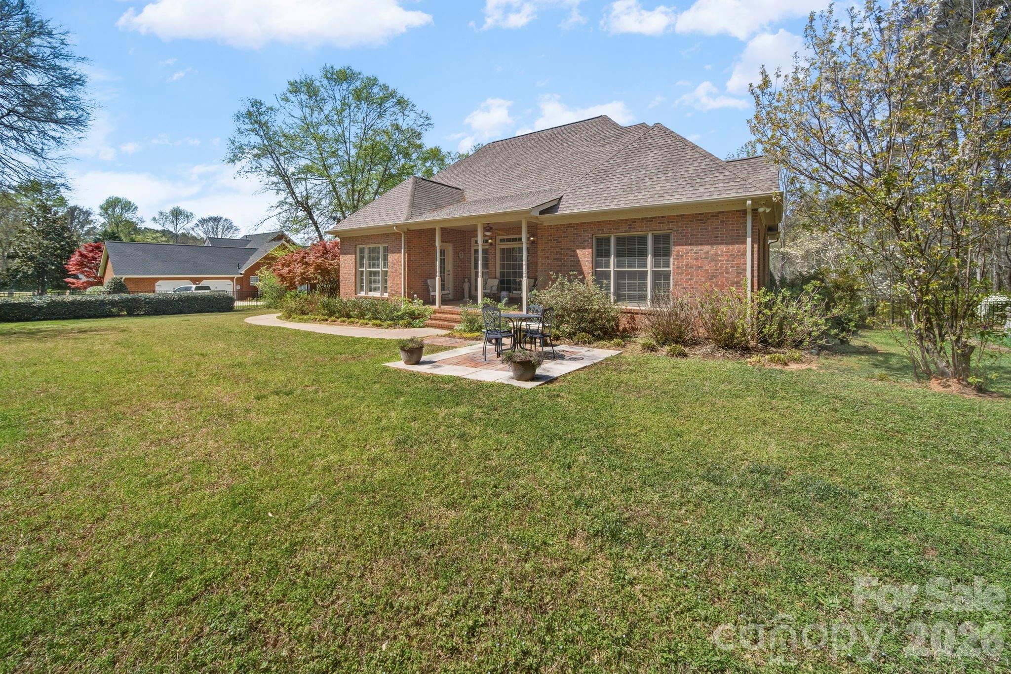 2909 Lakeshore Drive Chester, SC 29706 - Photo 6 of 44 a backyard of a house with garden and outdoor seating