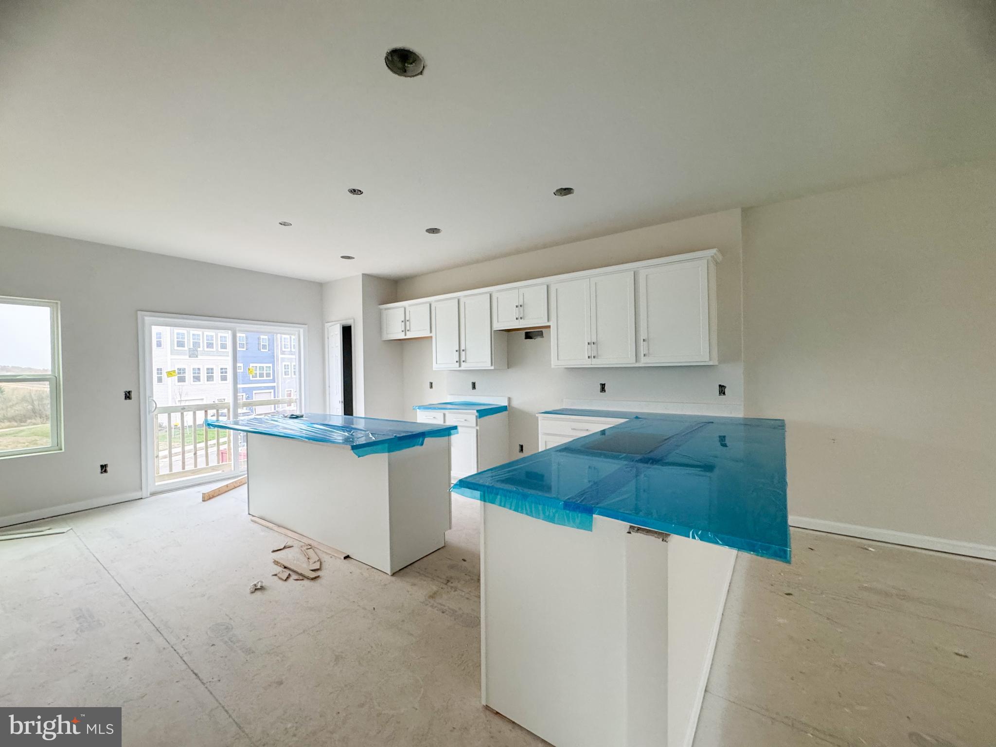 105 Gelding Way Stephenson, VA 22656 - Photo 4 of 16 a kitchen with stainless steel appliances white cabinets and wooden floors